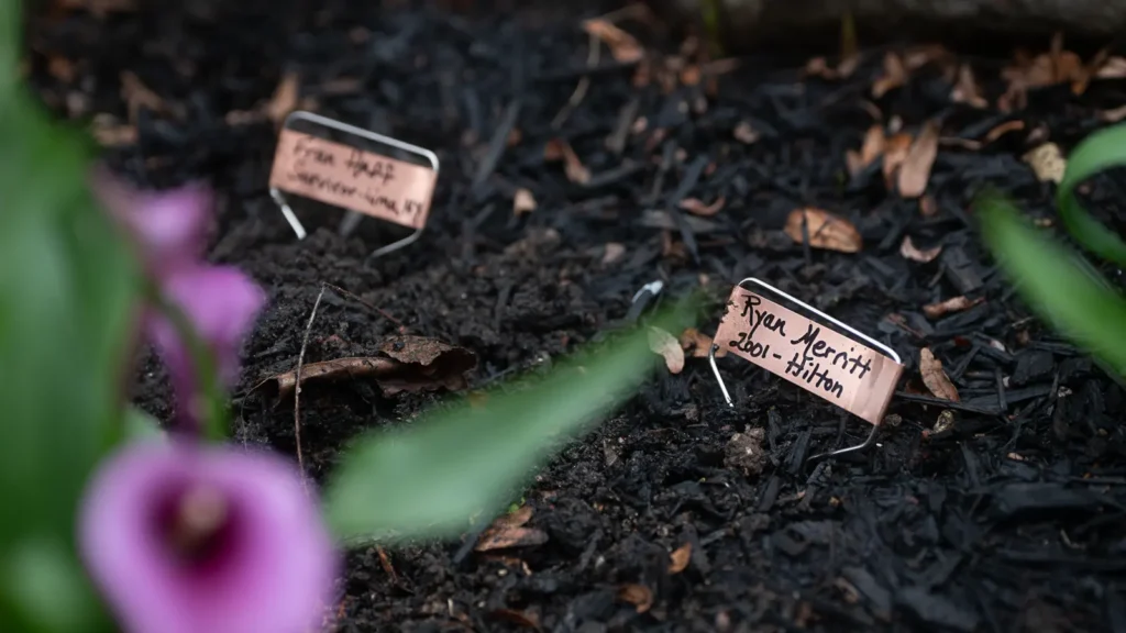 Copper memorial markers for Fran Haff and Ryan Merritt in the garden