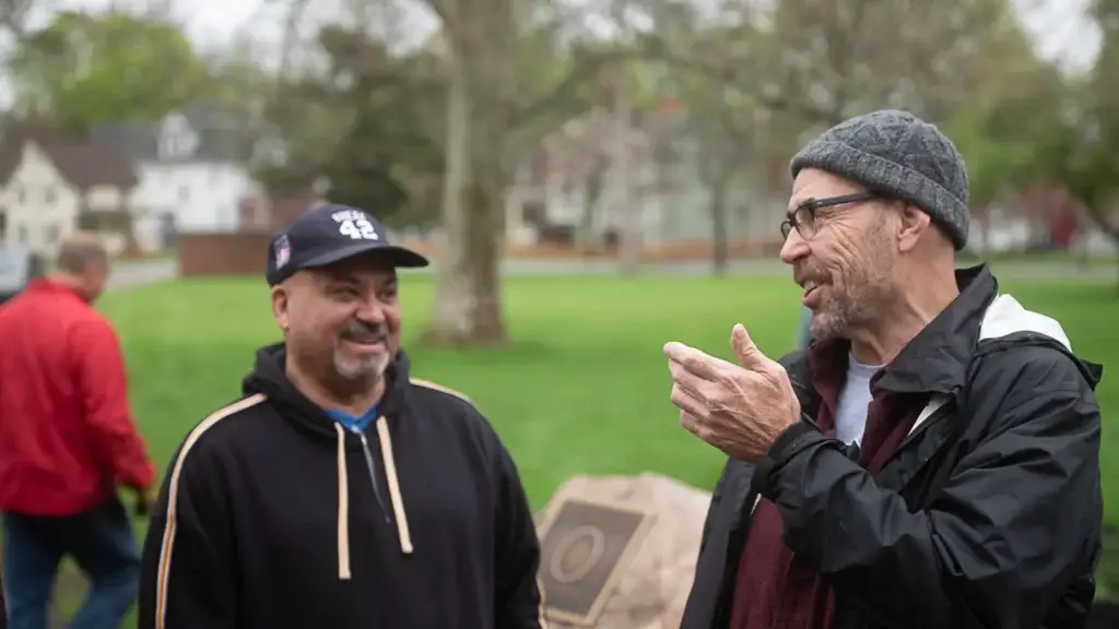 RAID members talk at the memorial garden planting